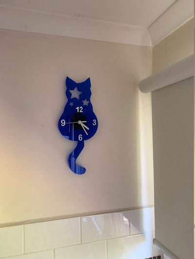 Wall clock with original design of a cat with stars blue silver numbers and white arms kids bedroom home decoration